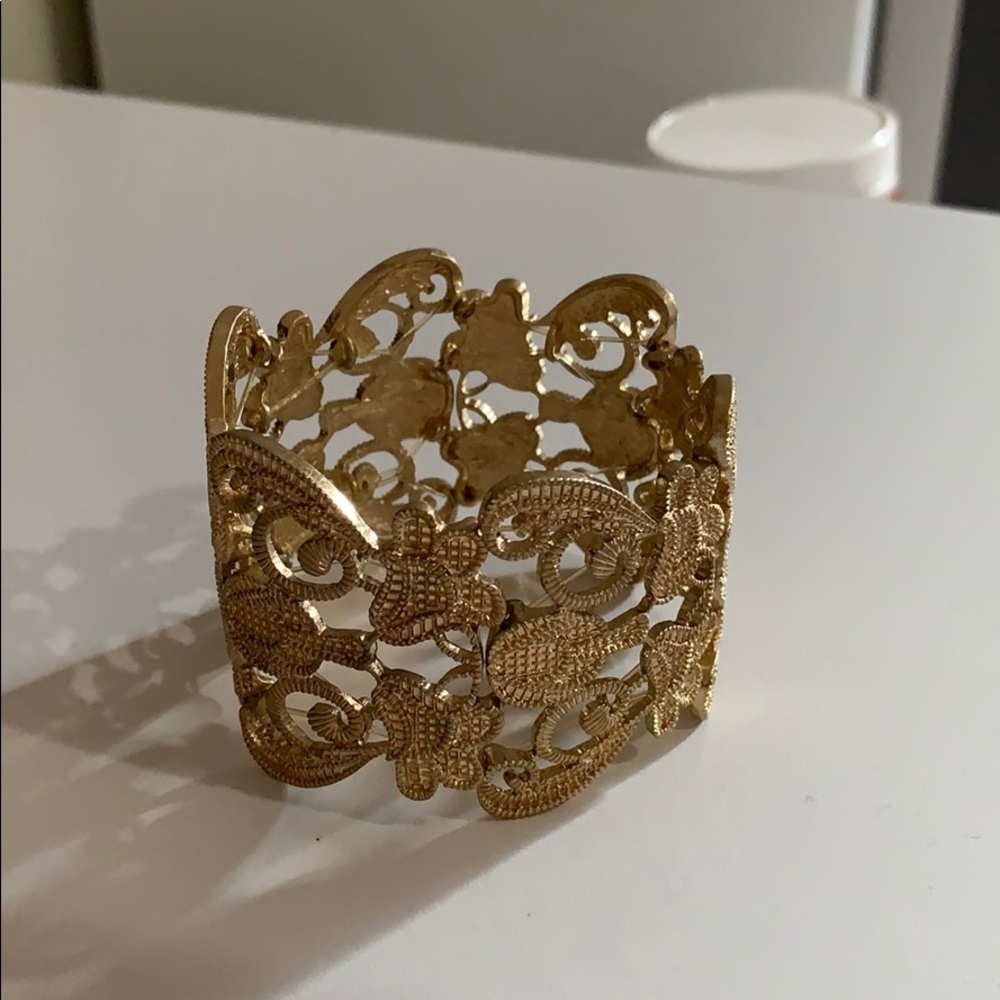 Gold bangle bracelet.